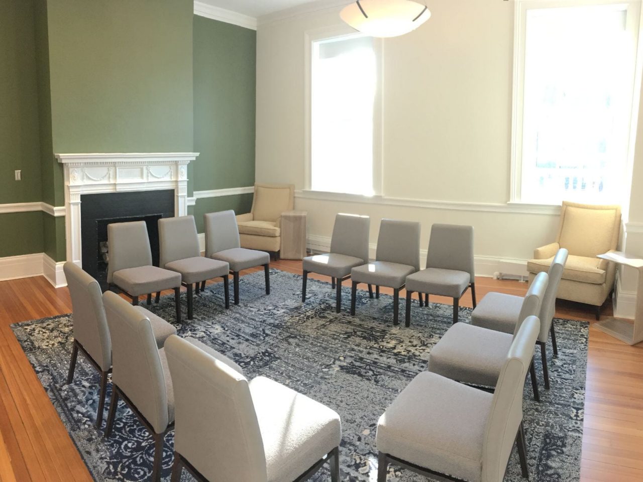 Small group discussion space with fireplace and chairs arranged in a circle